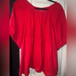 Peplum and puffy sleeves. Very vibrant color perfect for spring